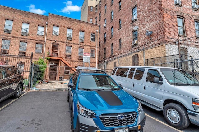 uncovered parking lot with fence