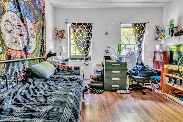 bedroom featuring wood finished floors