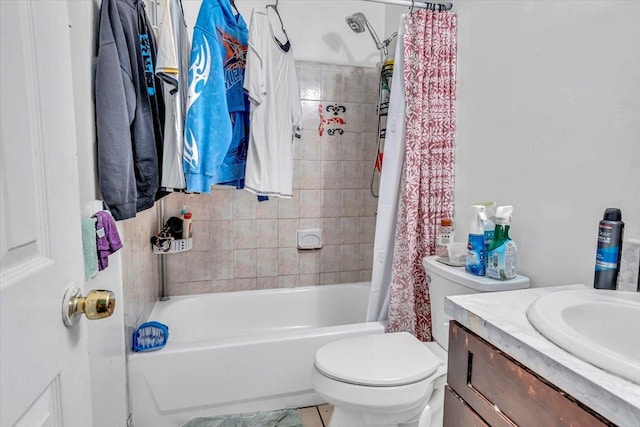 bathroom with toilet, shower / tub combo, and vanity