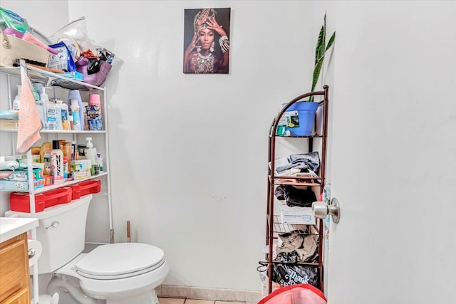 bathroom featuring vanity, toilet, and tile patterned floors