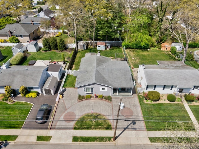 birds eye view of property with a residential view