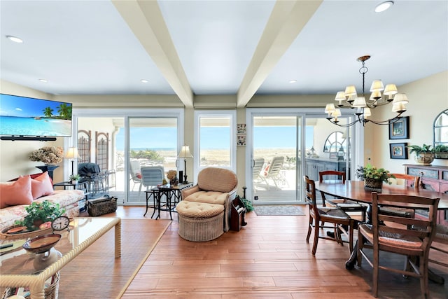 279 Dune Rd Unit 2, Westhampton Beach, NY 11978 - dining room with a chandelier, beam ceiling, wood finished floors, and recessed lighting