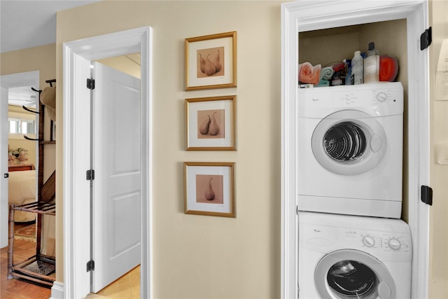 279 Dune Rd Unit 2, Westhampton Beach, NY 11978 - laundry area with stacked washer / drying machine