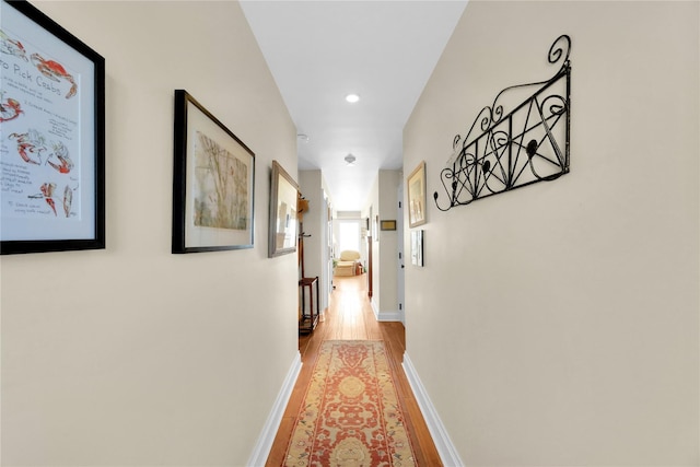 279 Dune Rd Unit 2, Westhampton Beach, NY 11978 - corridor with light wood finished floors, baseboards, and recessed lighting