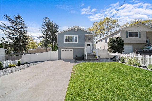 view of front of home with concrete driveway, a front yard, a garage, and fence