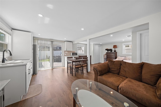 living area featuring recessed lighting and wood finished floors