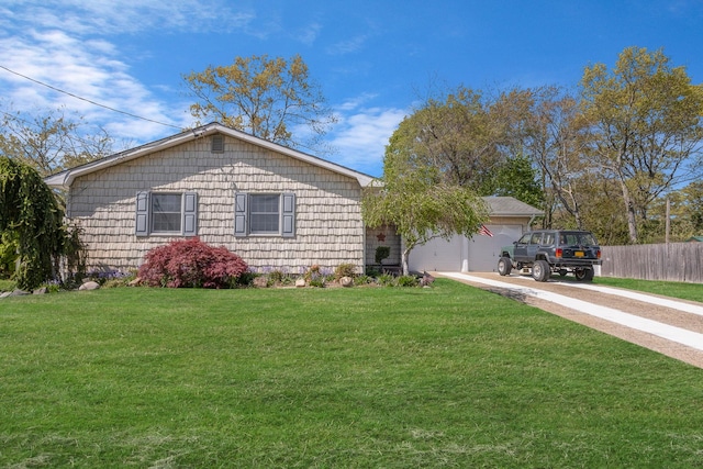 ranch-style house featuring concrete driveway, a garage, a front lawn, and fence