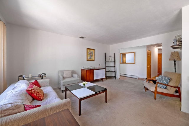 living room featuring a baseboard heating unit, visible vents, and light colored carpet