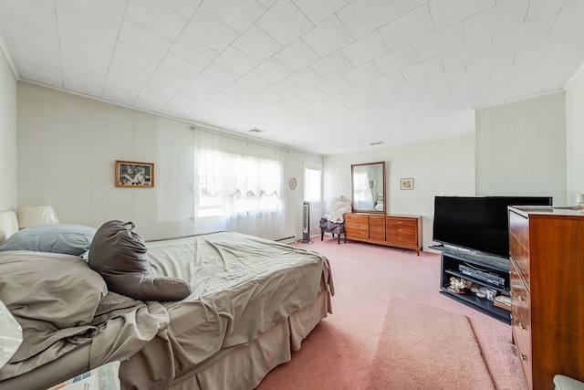 carpeted bedroom featuring visible vents and baseboard heating