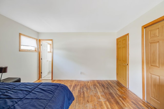 bedroom with light wood finished floors
