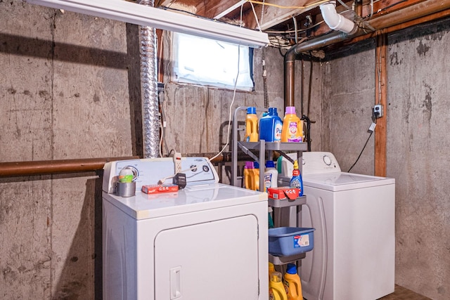 clothes washing area featuring laundry area and washer and dryer