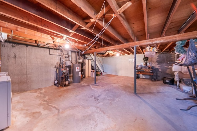unfinished below grade area with stairs, washer / dryer, a heating unit, and electric water heater