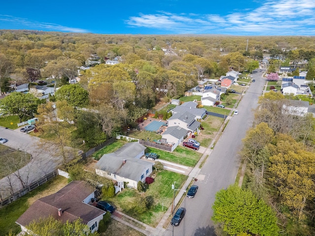 birds eye view of property with a forest view and a residential view