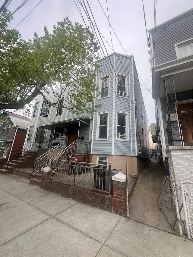 view of front of house with fence