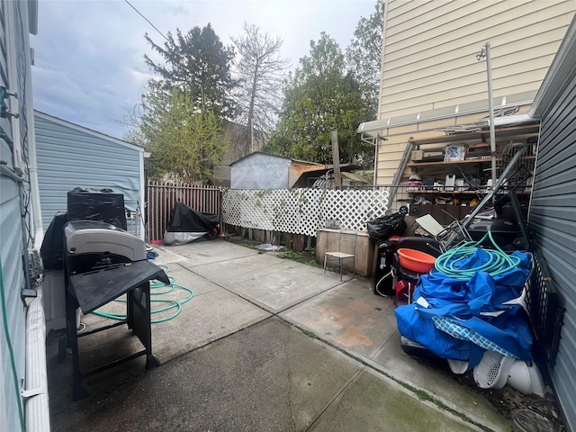view of patio featuring fence