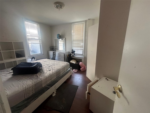 bedroom with wood finished floors