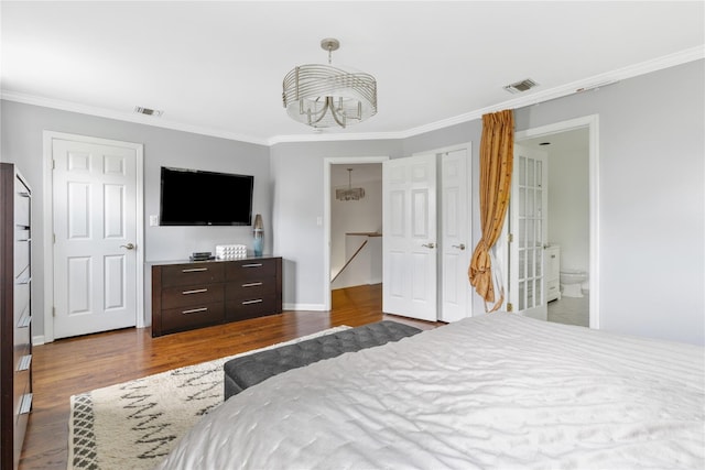 131 2nd St, Garden City, NY 11530 - bedroom with ornamental molding, a chandelier, wood finished floors, and ensuite bathroom