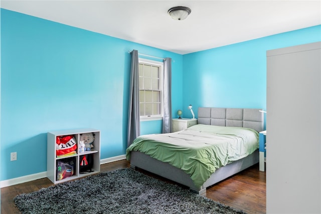 131 2nd St, Garden City, NY 11530 - bedroom with wood finished floors and baseboards