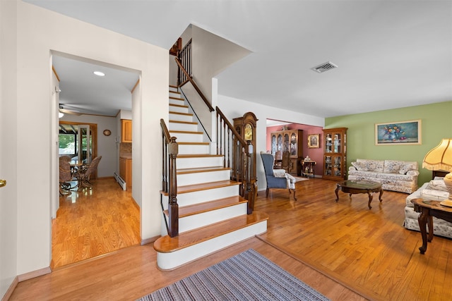 35 Capt Faldermeyer Dr, Stony Point, NY 10980 - staircase with wood finished floors, baseboards, a baseboard radiator, and ceiling fan