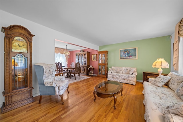 35 Capt Faldermeyer Dr, Stony Point, NY 10980 - living room featuring a chandelier, wood finished floors, and baseboards