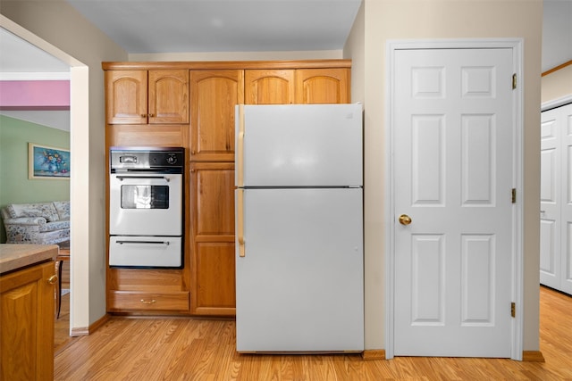 35 Capt Faldermeyer Dr, Stony Point, NY 10980 - kitchen with freestanding refrigerator, stainless steel oven, a warming drawer, and light wood-style flooring
