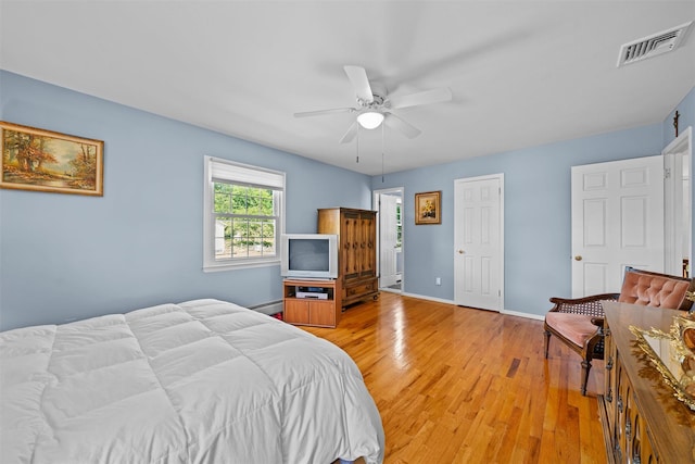 35 Capt Faldermeyer Dr, Stony Point, NY 10980 - bedroom with light wood-style floors, a baseboard heating unit, baseboards, and a ceiling fan