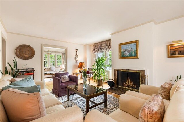 67 Walbrooke Rd, Scarsdale, NY 10583 - living room featuring wood finished floors, ornamental molding, and a tiled fireplace