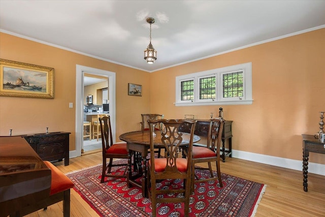 67 Walbrooke Rd, Scarsdale, NY 10583 - dining space featuring light wood-type flooring, crown molding, baseboards, and a chandelier
