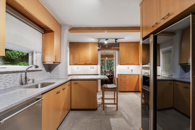 67 Walbrooke Rd, Scarsdale, NY 10583 - kitchen with a sink, stainless steel dishwasher, decorative backsplash, and healthy amount of natural light