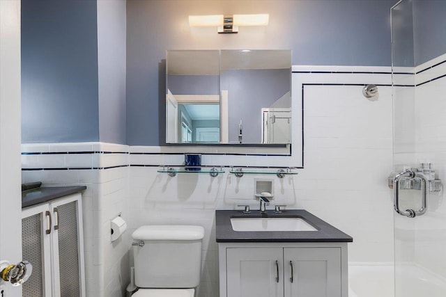 67 Walbrooke Rd, Scarsdale, NY 10583 - full bath featuring tile walls, a shower stall, toilet, vanity, and a wainscoted wall