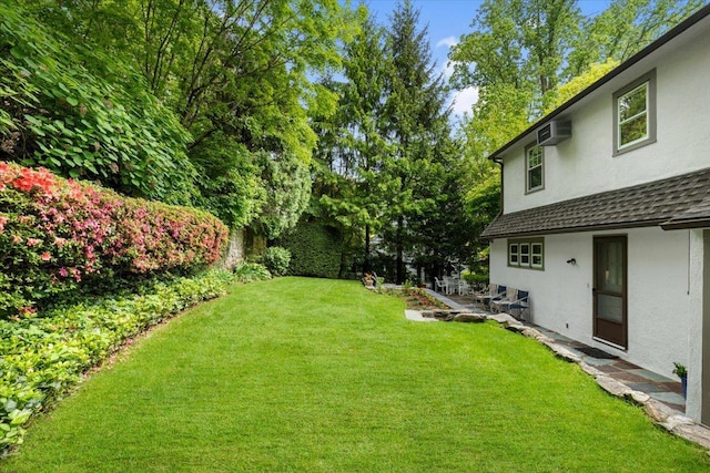 67 Walbrooke Rd, Scarsdale, NY 10583 - view of green lawn featuring a wall unit AC
