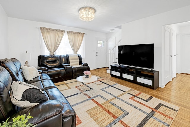 199 Guildford Ct, West Hempstead, NY 11552 - living area featuring wood finished floors, baseboards, and a chandelier