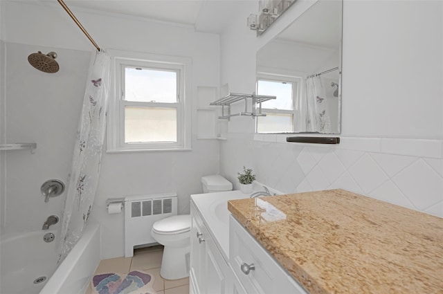 199 Guildford Ct, West Hempstead, NY 11552 - bathroom featuring radiator, toilet, vanity, shower / tub combo, and tile patterned flooring