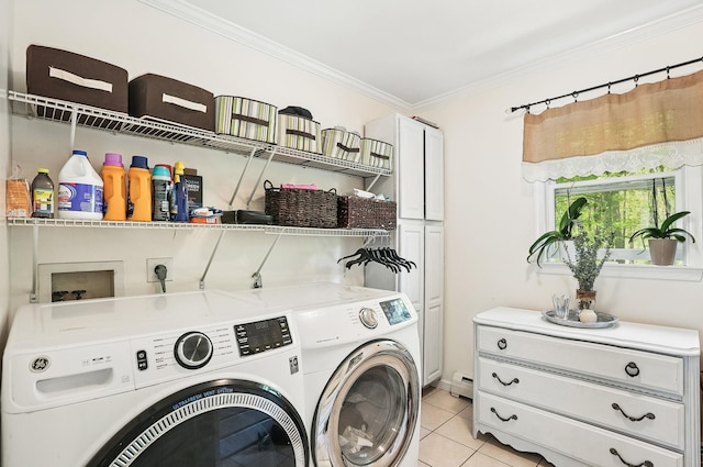 304 Church Rd, Putnam Valley, NY 10579 - laundry room featuring washing machine and dryer, crown molding, a baseboard radiator, light tile patterned floors, and cabinet space