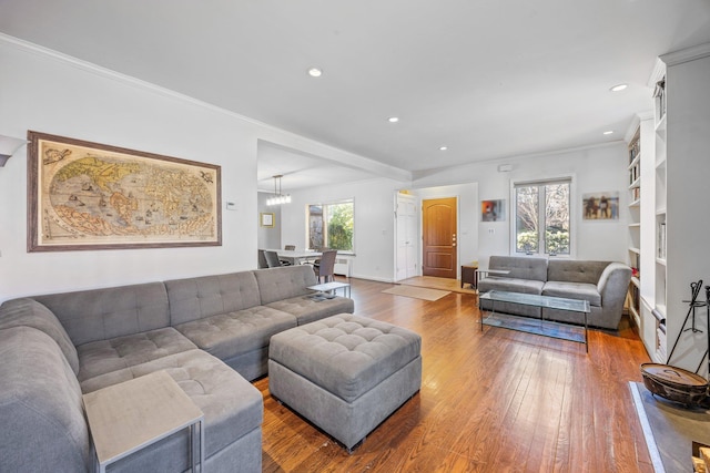 8702 Chevy Chase St, Jamaica Estates, NY 11432 - living room featuring wood-type flooring, healthy amount of natural light, crown molding, recessed lighting, and a chandelier