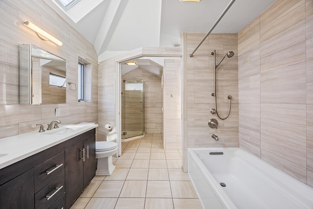 8702 Chevy Chase St, Jamaica Estates, NY 11432 - bathroom featuring toilet, tile patterned floors, vanity, bathtub / shower combination, and a skylight