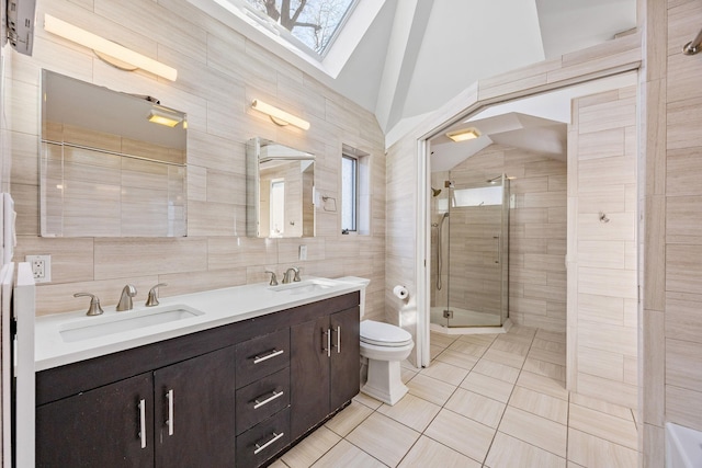 8702 Chevy Chase St, Jamaica Estates, NY 11432 - bathroom featuring tile walls, a shower stall, plenty of natural light, toilet, and tile patterned floors