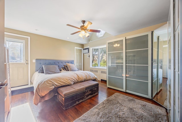 8702 Chevy Chase St, Jamaica Estates, NY 11432 - bedroom with multiple windows, dark wood-style flooring, ceiling fan, lofted ceiling, and a wall mounted AC