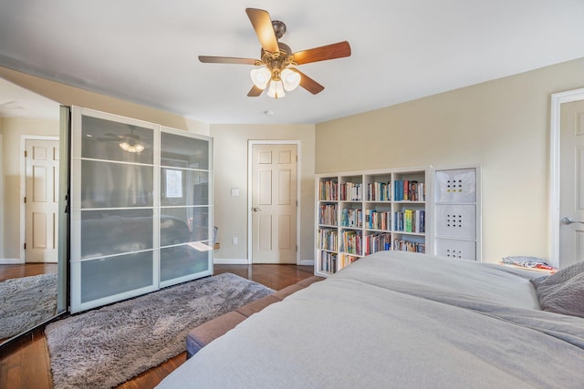 8702 Chevy Chase St, Jamaica Estates, NY 11432 - bedroom featuring wood finished floors, baseboards, and ceiling fan
