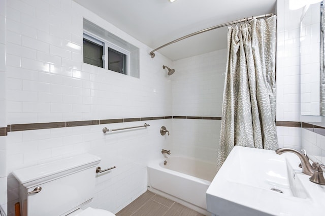 8702 Chevy Chase St, Jamaica Estates, NY 11432 - bathroom featuring tile walls, a sink, toilet, and shower / bath combo