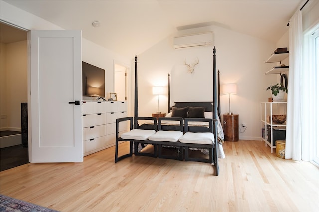 96 Grove St, Beacon, NY 12508 - bedroom with a wall mounted air conditioner, lofted ceiling, and light wood finished floors