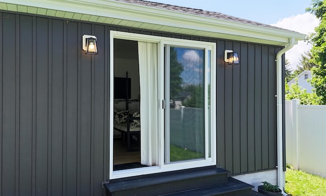 96 Grove St, Beacon, NY 12508 - view of exterior entry with a shingled roof and board and batten siding
