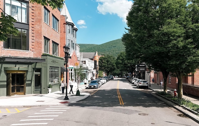 96 Grove St, Beacon, NY 12508 - view of asphalt street with curbs, a mountain view, street lights, sidewalks, and a residential view