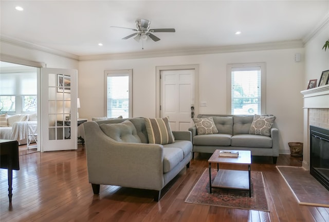 7 N Howells Point Rd, Bellport Village, NY 11713 - living area featuring plenty of natural light, a fireplace, dark wood-type flooring, ornamental molding, and ceiling fan