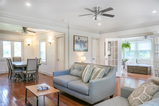 7 N Howells Point Rd, Bellport Village, NY 11713 - living room with ceiling fan, plenty of natural light, crown molding, hardwood / wood-style floors, and baseboards