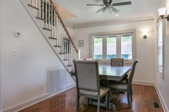 7 N Howells Point Rd, Bellport Village, NY 11713 - dining room featuring ornamental molding, a ceiling fan, dark wood-style flooring, baseboards, and stairway