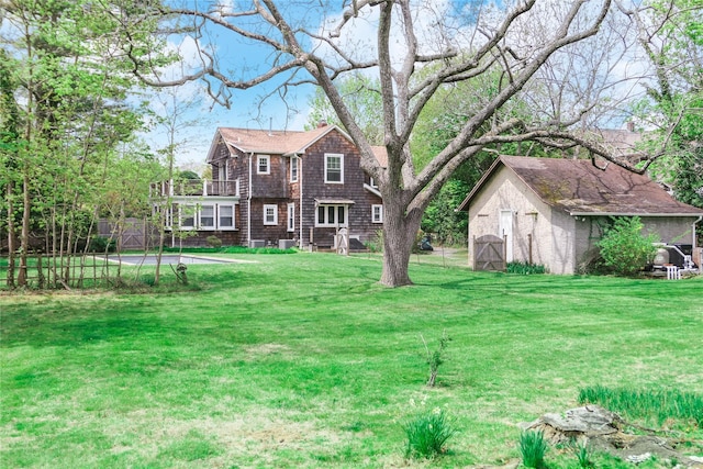 7 N Howells Point Rd, Bellport Village, NY 11713 - view of yard with a storage shed, a balcony, and an outbuilding