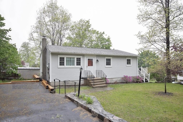 135 Cottage Rd, Carmel, NY 10512 - view of front of house featuring a chimney, a front lawn, and roof with shingles