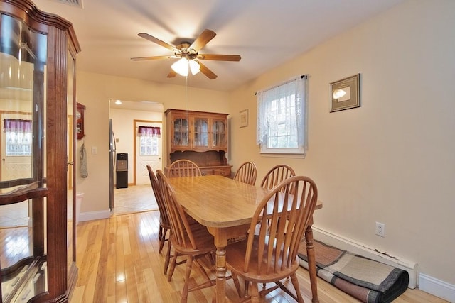135 Cottage Rd, Carmel, NY 10512 - dining space featuring ceiling fan, light wood-style flooring, baseboards, and baseboard heating