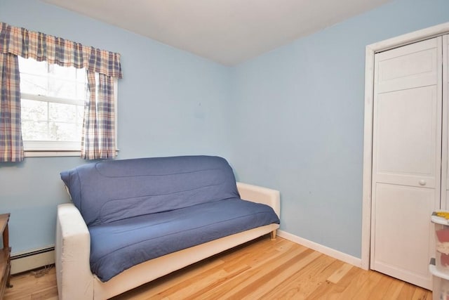 135 Cottage Rd, Carmel, NY 10512 - living area with baseboard heating, wood finished floors, and baseboards